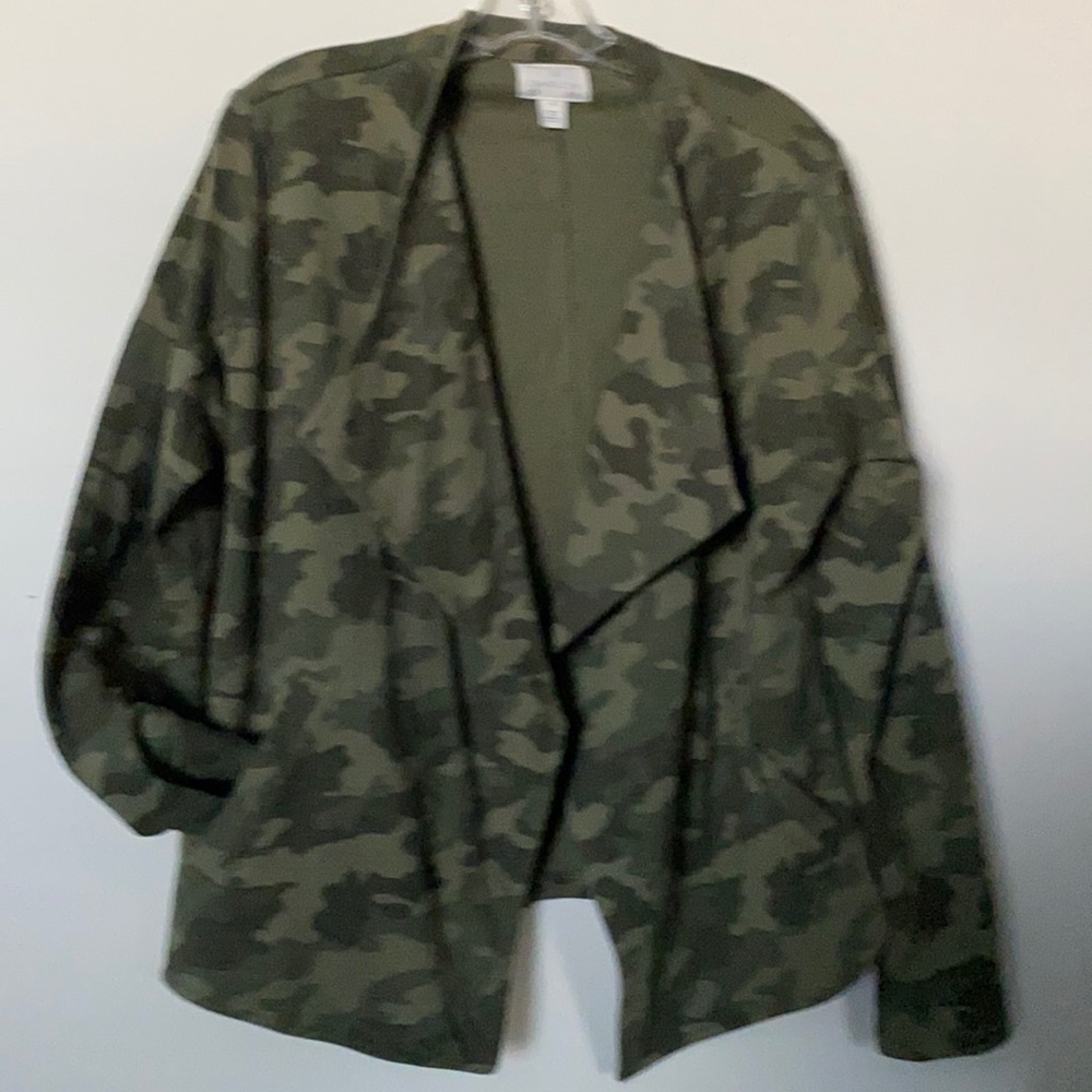 Women’s camouflage jacket runs a little small. Two front pockets.
